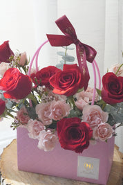 Close-up of red and blush roses with spray roses highlighting color contrast and floral detail