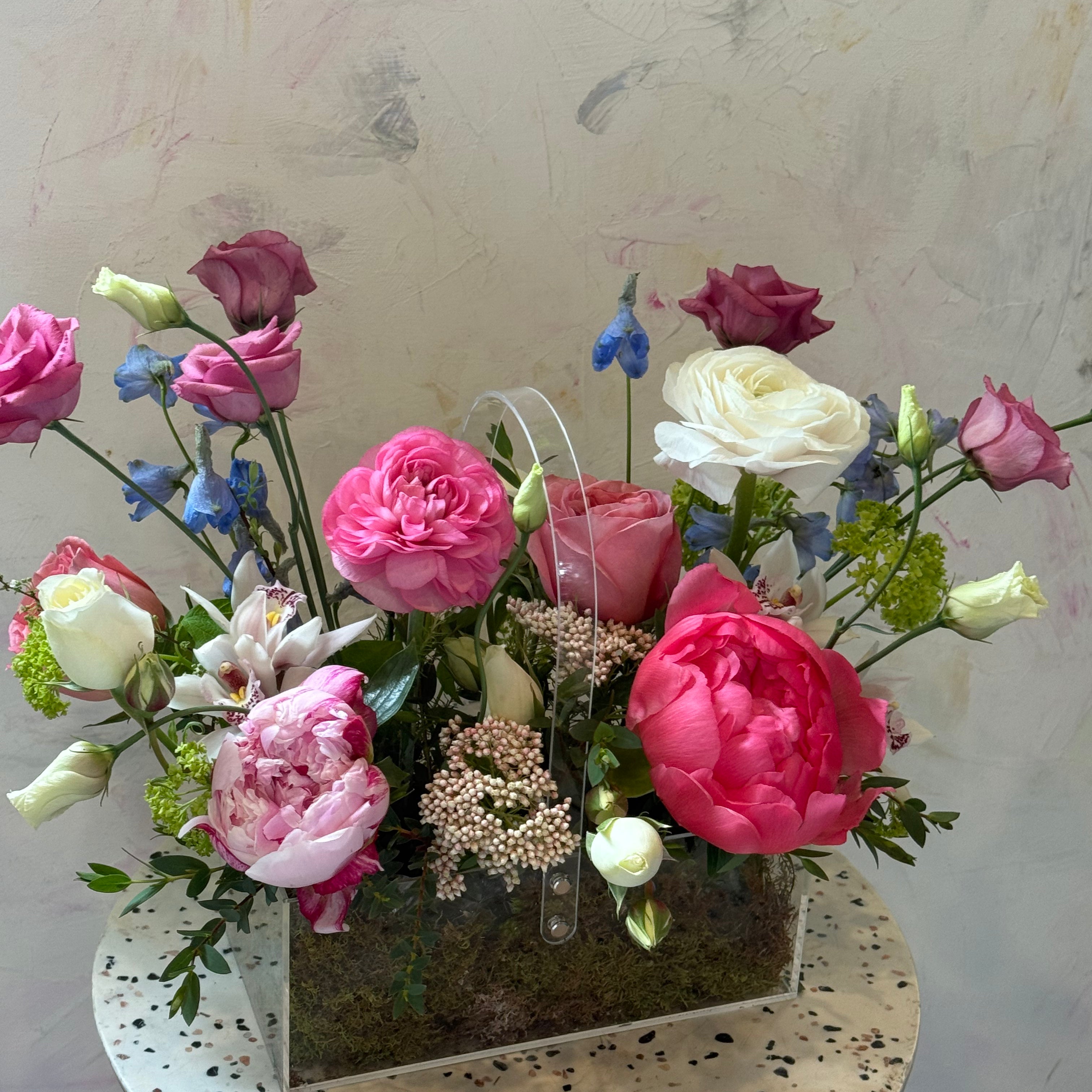 garden style floral arrangement soft pink tones