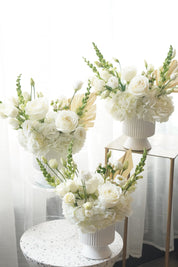 Ivory tone flower centerpiece with hydrangea and lisianthus