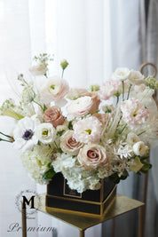 Just Because arrangement featuring premium pink roses, white hydrangeas, and  calla lilies. Available for same-day flower delivery in Toronto, Oakville, and the GTA. gold stand with a white curtain background