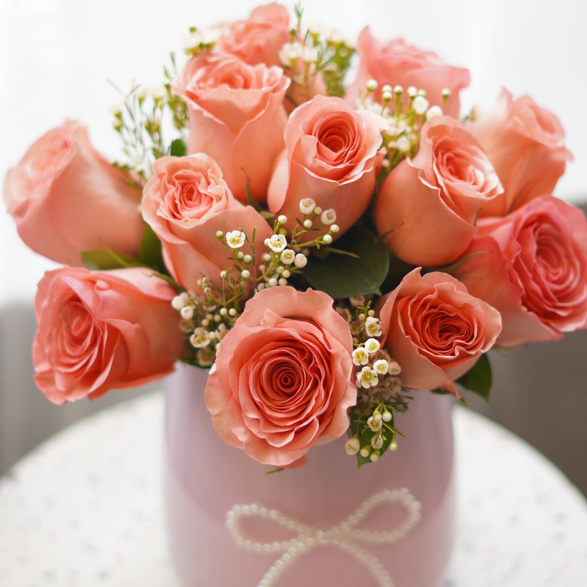 legant dozen coral roses arrangement designed by Moon’s Flower