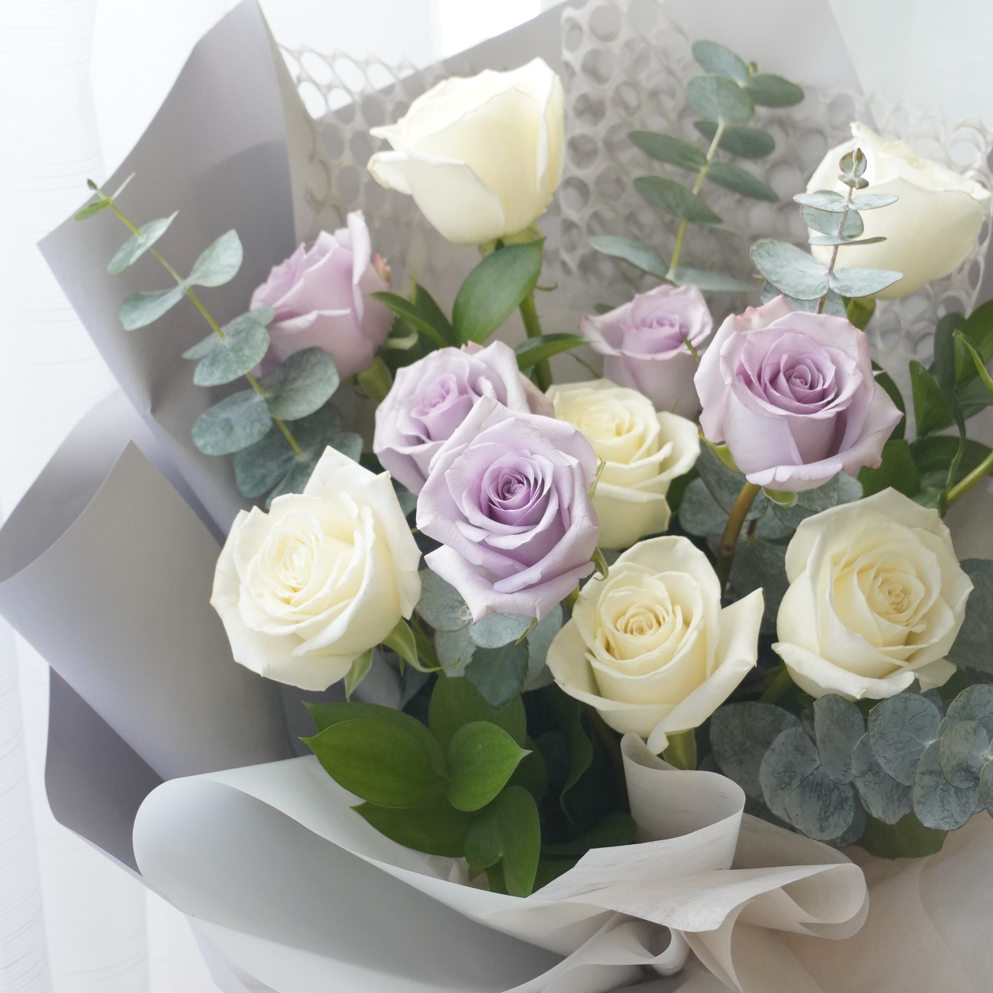 Front view of the bouquet, including wrapping paper.Toronto flower delivery by Moon’s Flowers