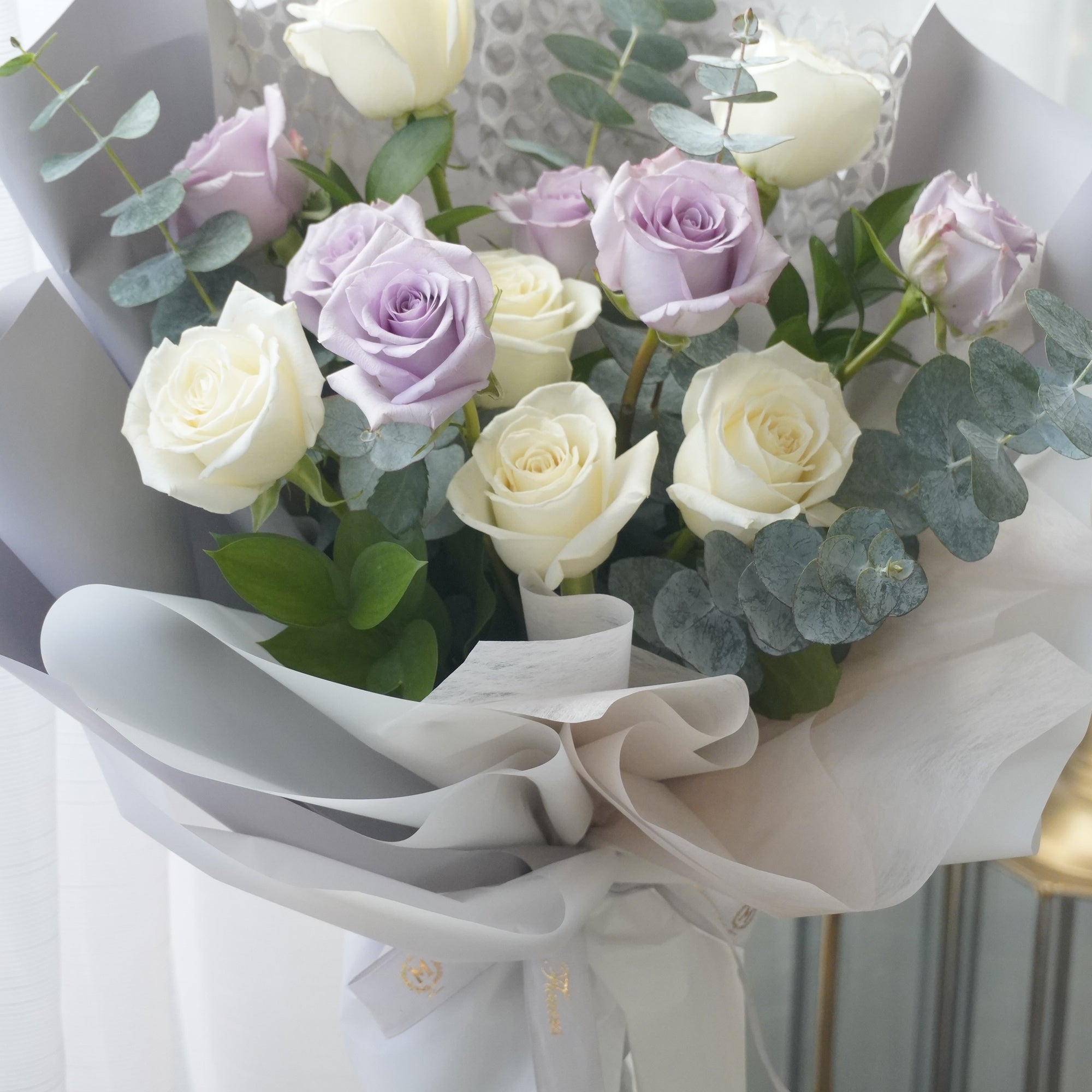 Front view of the bouquet, including wrapping paper.Toronto flower delivery by Moon’s Flowers