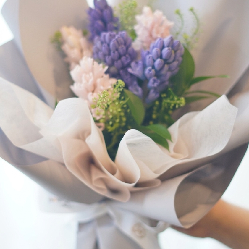 Lavender hyacinth bouquet wrapped in neutral paper – Moon’s Flowers Toronto