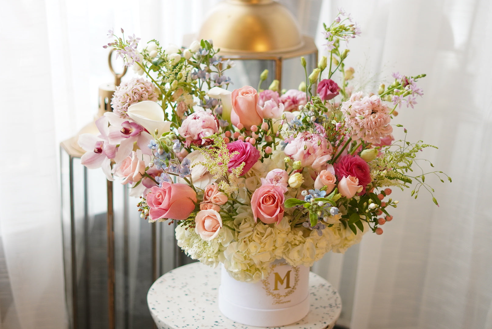 Lush pastel pink floral centerpiece with premium roses and peony in a stylish gift box, ideal for Mother's Day table styling and celebrations