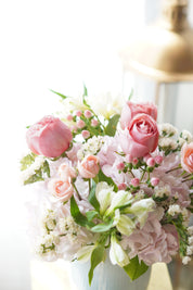 Bouquet of pink and white flowers on a light background