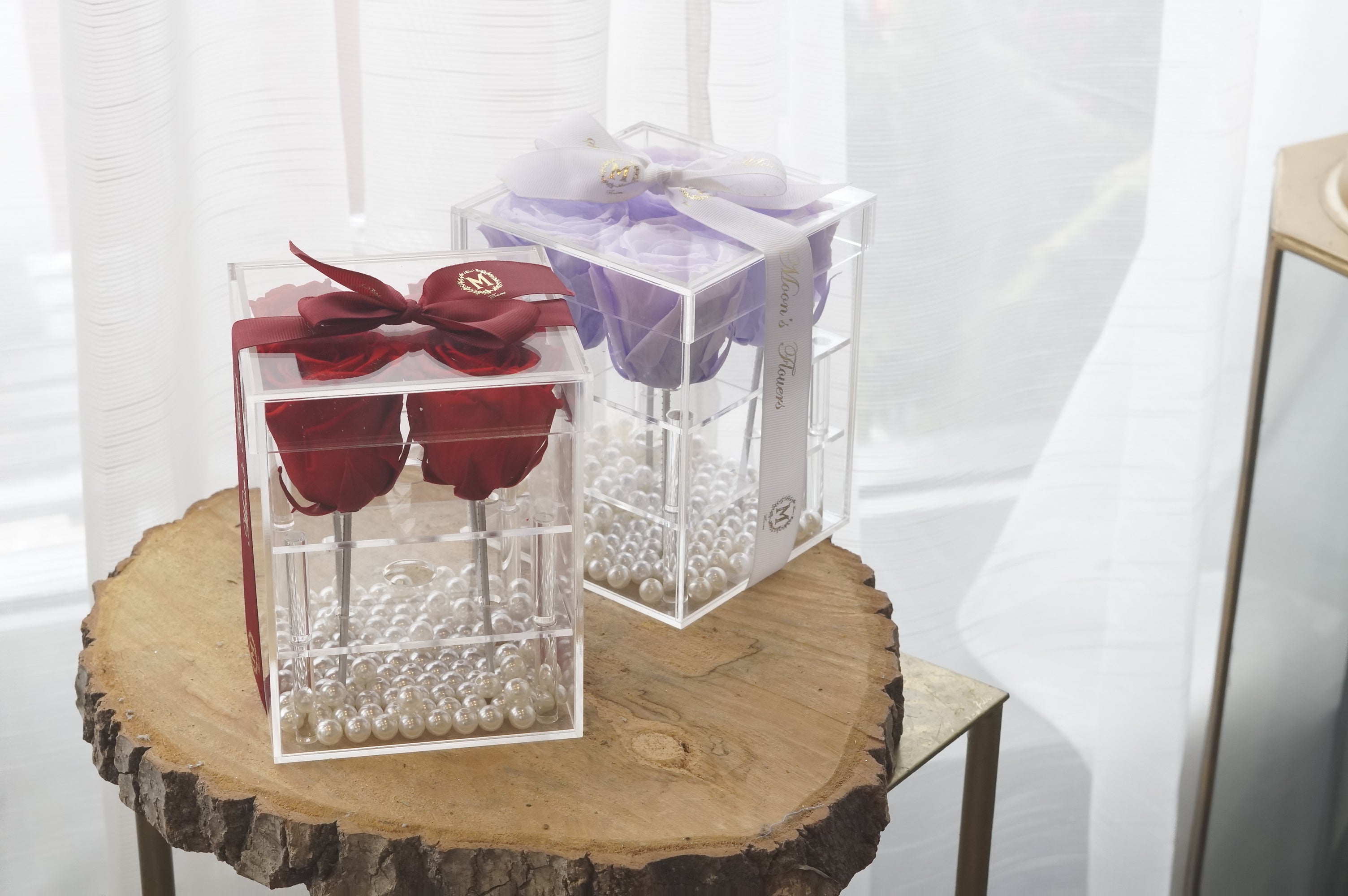 Red and Lilac Preserved Roses in Acrylic Boxes side-by-side comparing and contrasting the unique colour options.