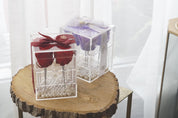 Red and Lilac Preserved Roses in Acrylic Boxes side-by-side comparing and contrasting the unique colour options.