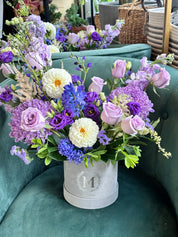 Purple Blossom Box closeup of fresh blooms like lavender roses, lisianthus, and purple chrysanthemums