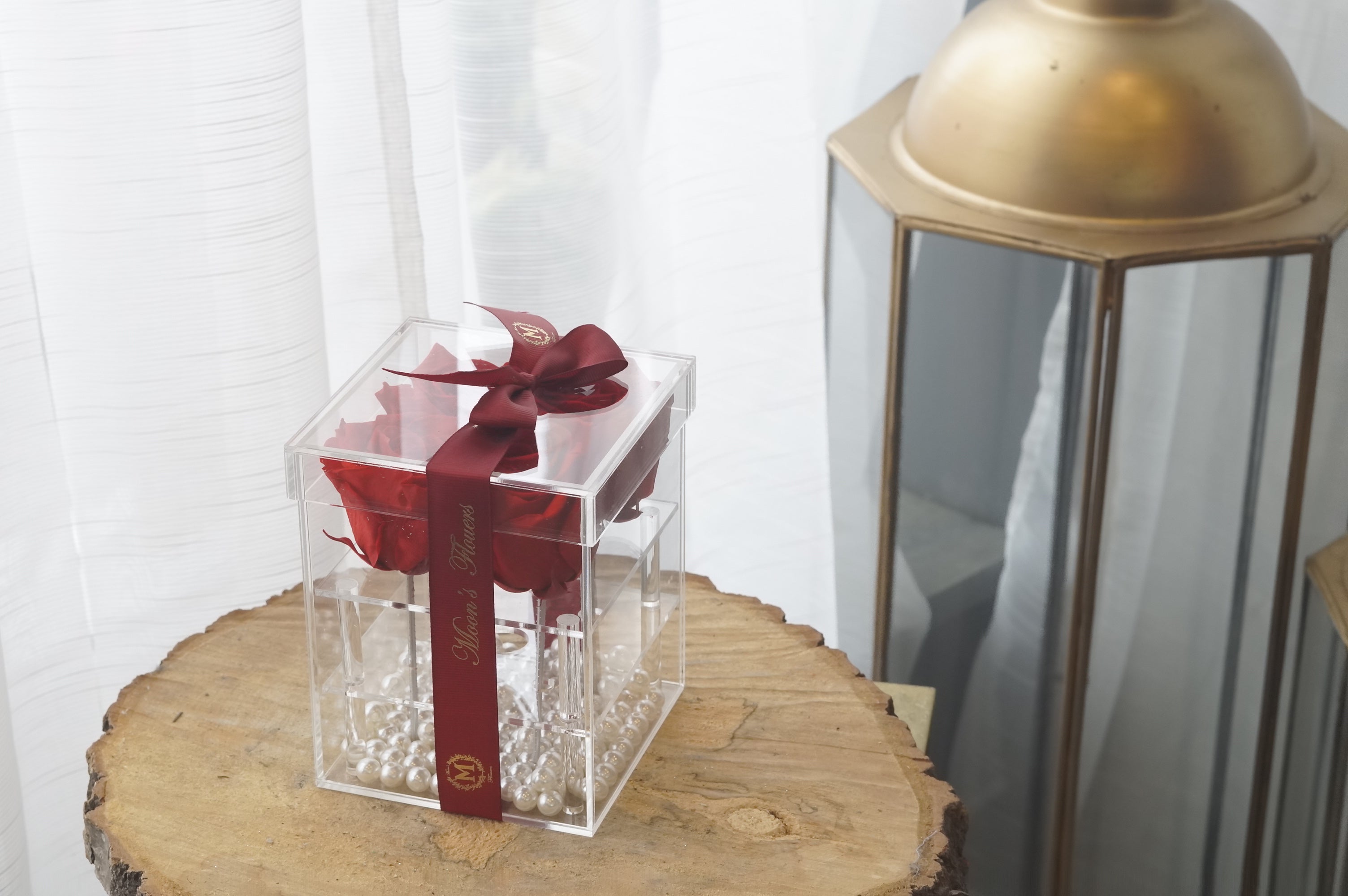 Close up and focal image of the Red preserved roses in acrylic box.