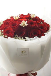 30 red roses round bouquet with white wrapping