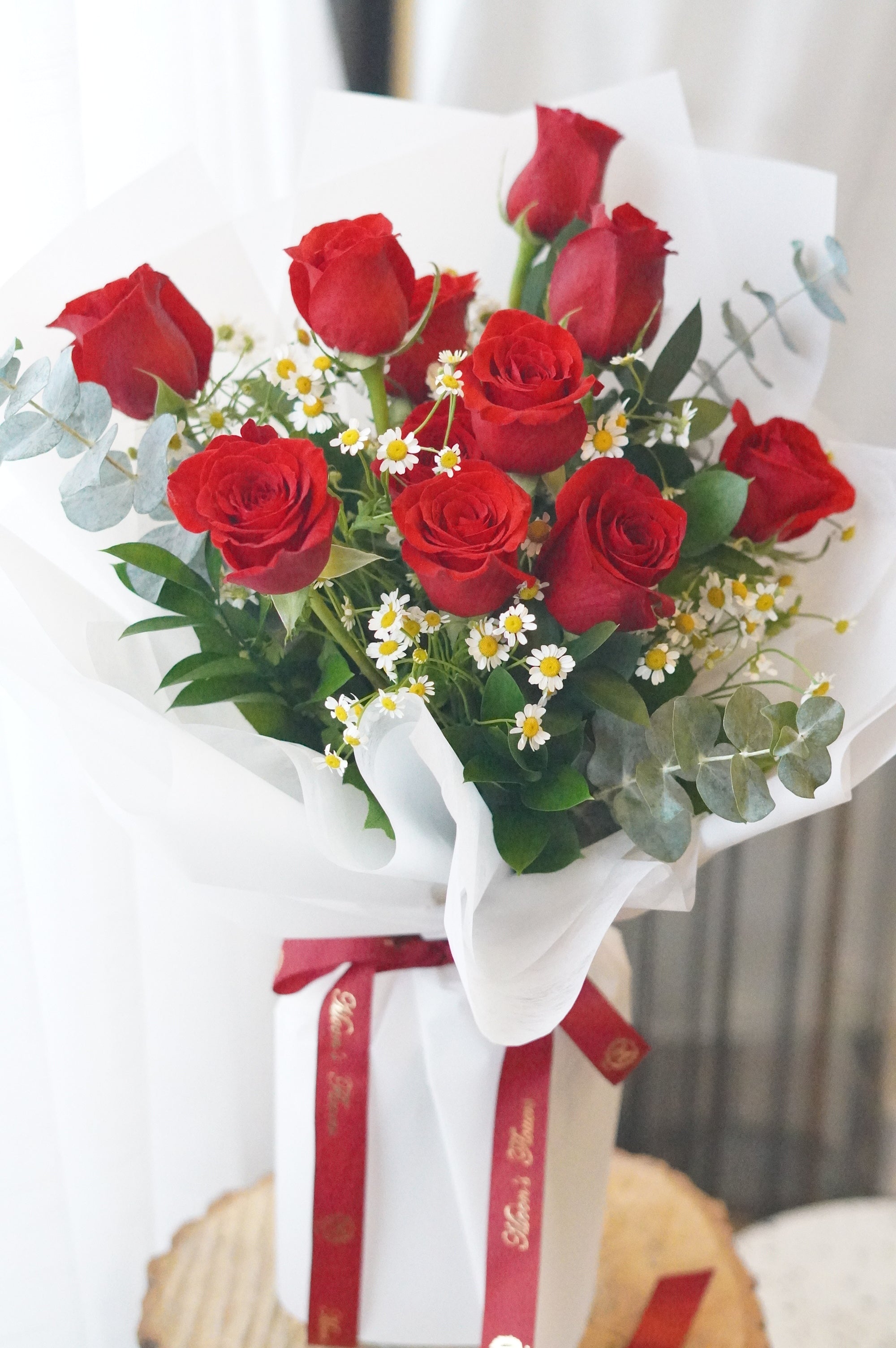 Rose in the Garden bouquet featuring dozen red roses with chamomile and fresh greenery