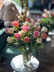 White and pink mixed roses arranged in a vase