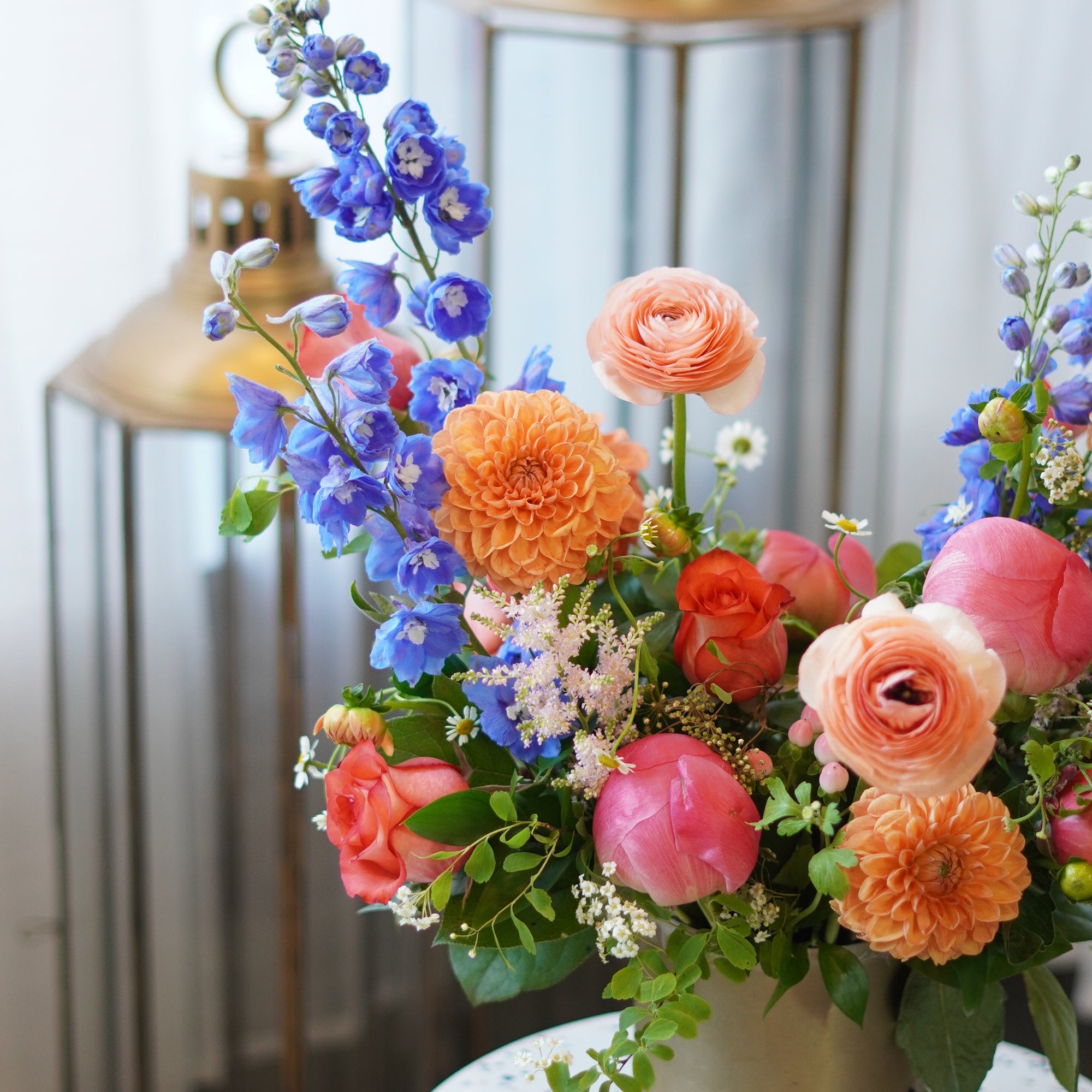 Premium Mother's Day flowers from Moon's Flowers. Colorful 'Sunset Serenity' arrangement with seasonal spring blooms, professionally designed for delivery in Toronto, Oakville, and the GTA