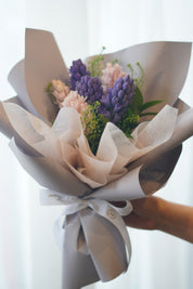 Spring hyacinth bouquet with blush tones and soft wrapping