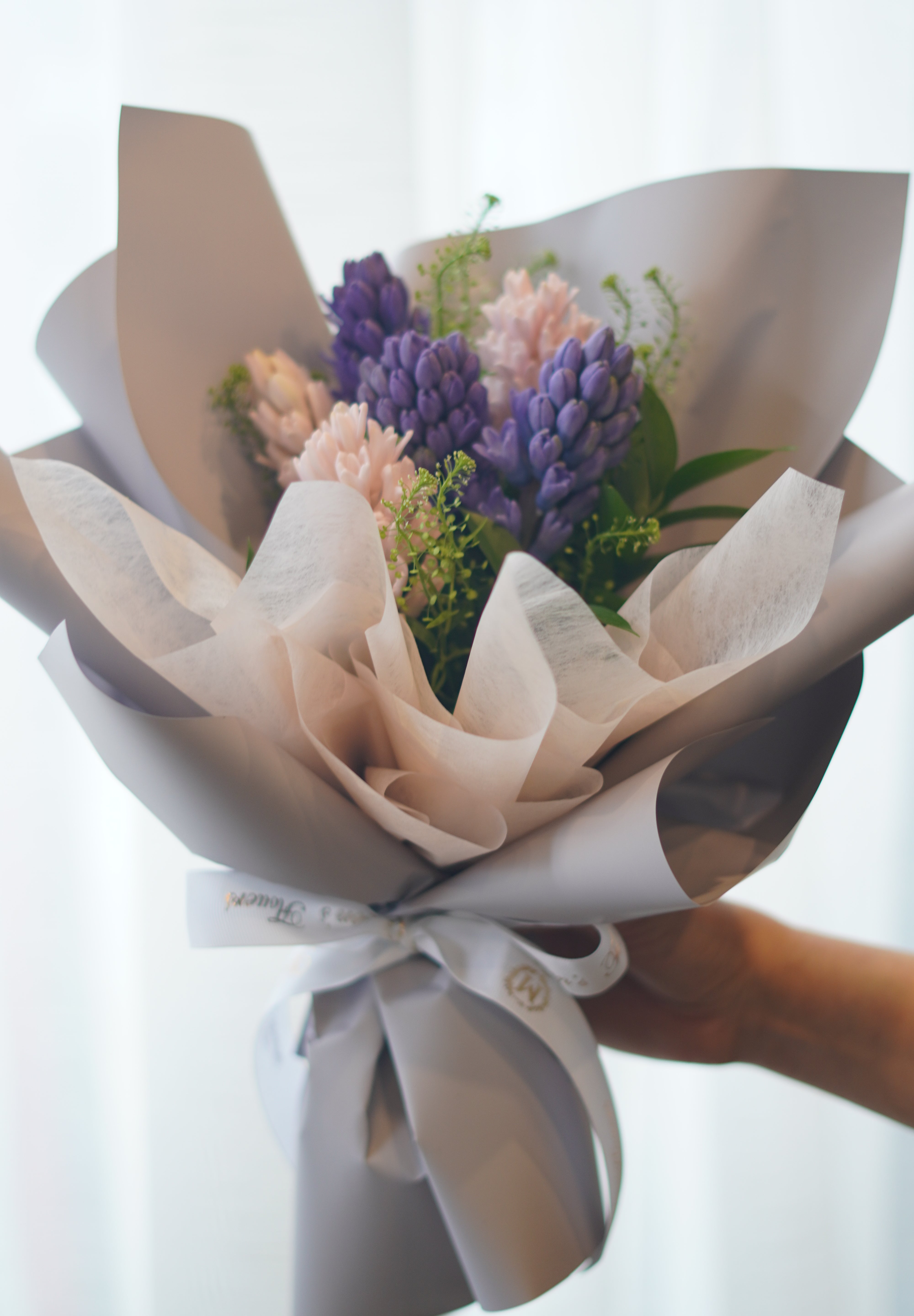 Spring hyacinth bouquet with blush tones and soft wrapping