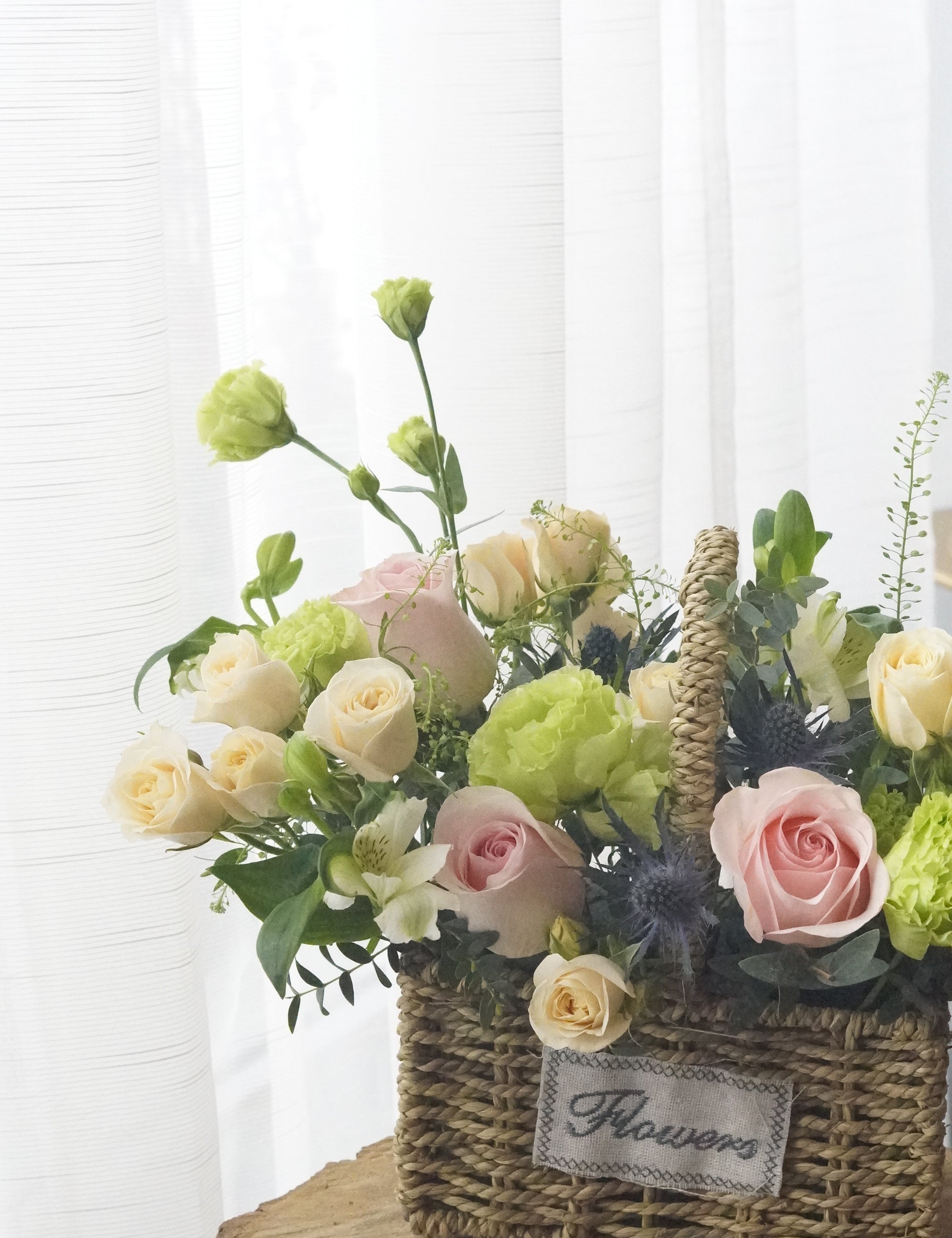 Close up of Spring in a Basket showcasing the unique blend of flowers.