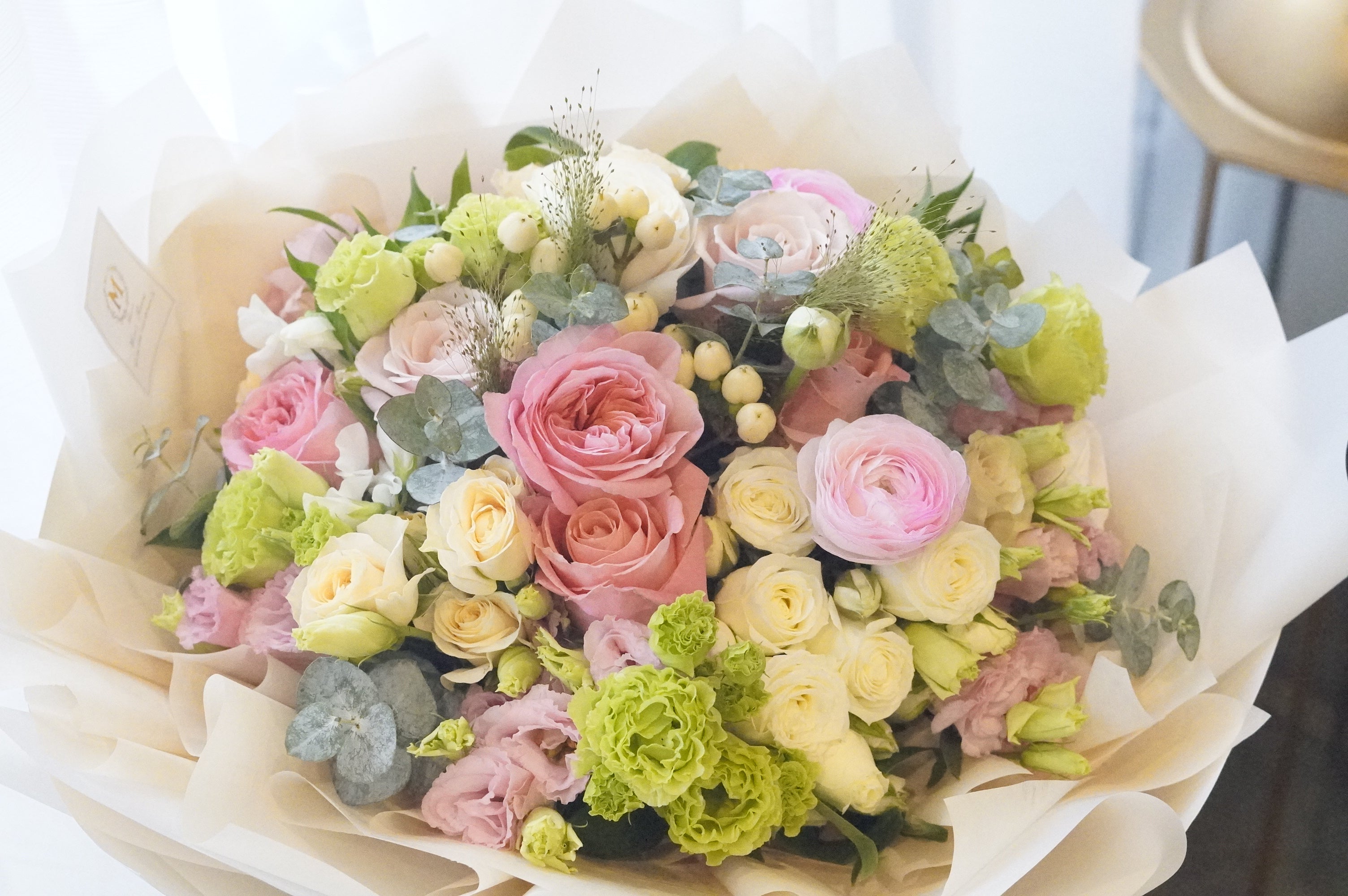 Timeless Embrace Mother's Day bouquet by Moon's Flowers, featuring a delicate arrangement of pastel roses and seasonal greenery for same-day delivery in Toronto