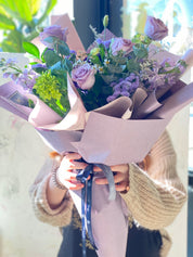 Vibrant Mother's Day Purple Rush bouquet featuring deep purple and lavender seasonal flowers in a designer hand-tied wrap by Moon's Flowers Toronto