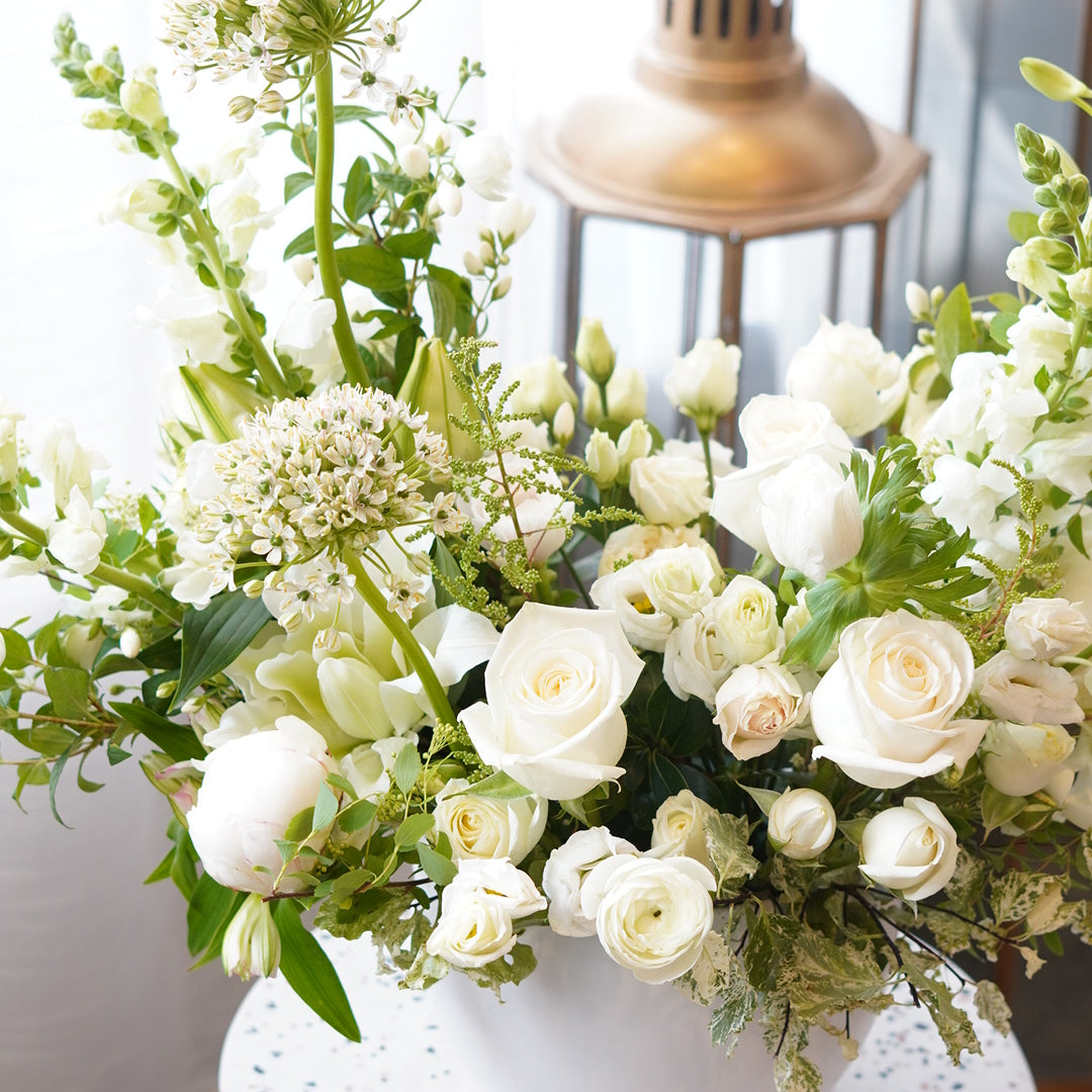 White funeral flower arrangement for home or service delivery in Oakville and Mississauga.