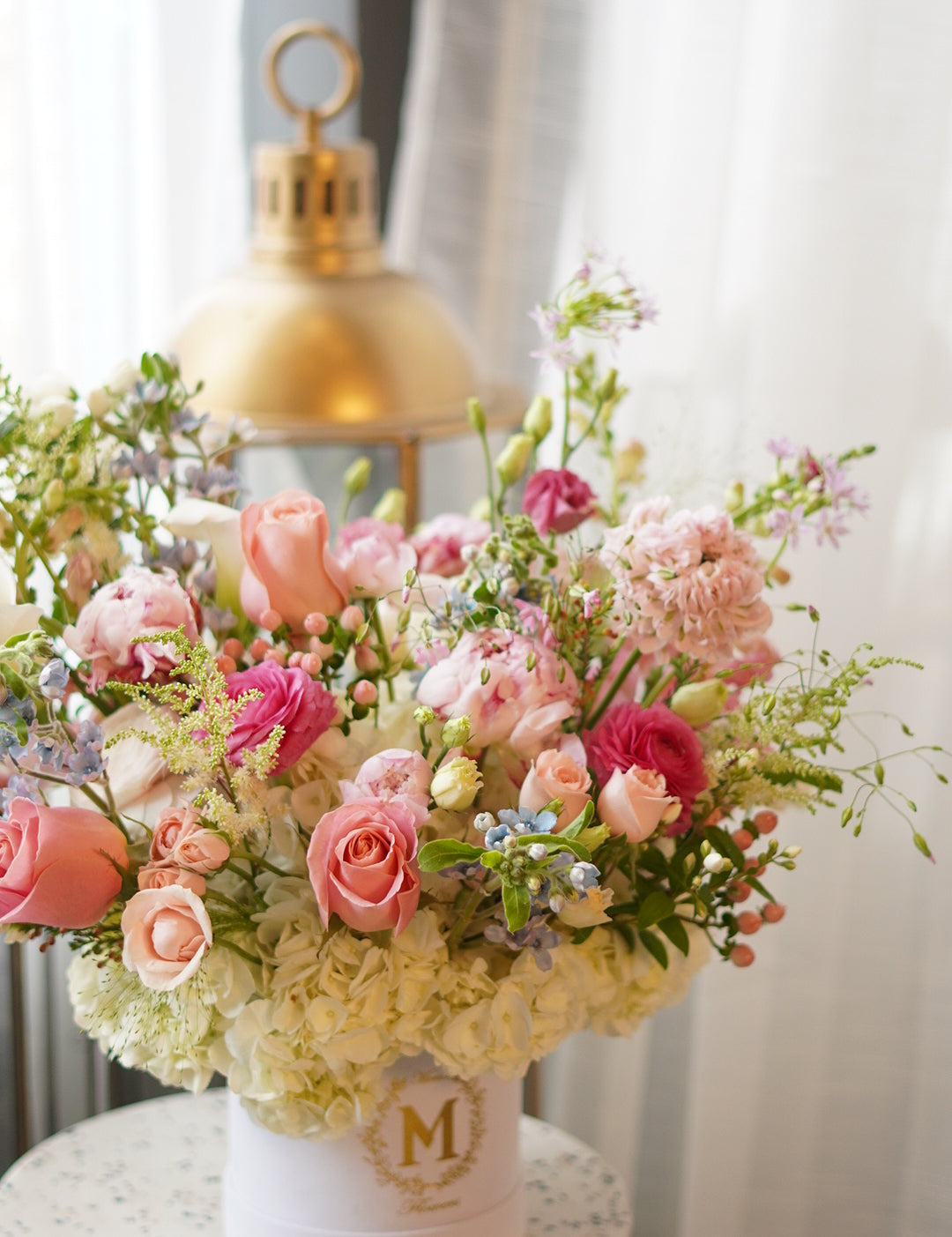 a garden-style centerpiece featuring soft pink roses, wax flowers in a premium giftbox, perfect for Mother's Day table decor