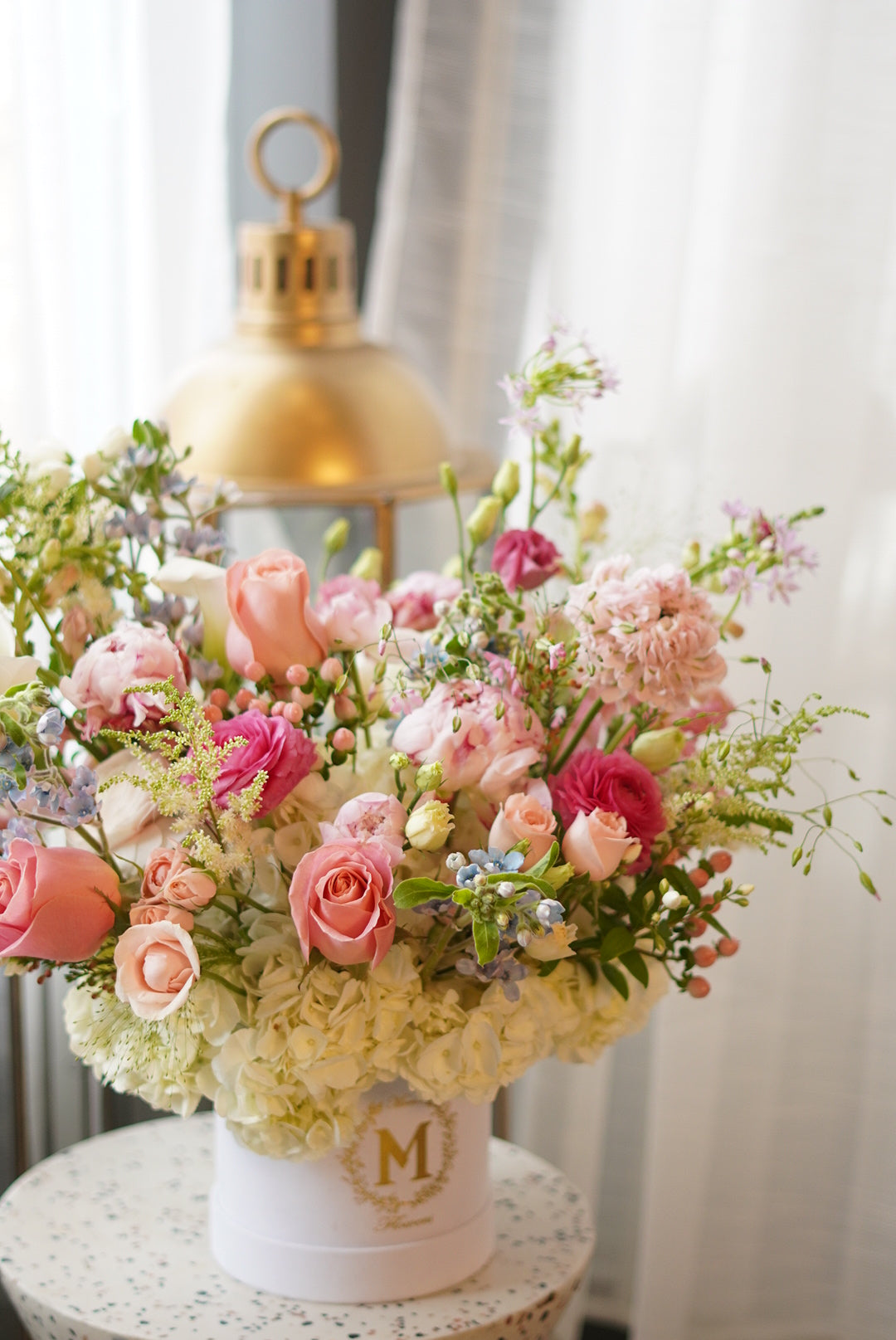 a garden-style centerpiece featuring soft pink roses, wax flowers in a premium giftbox, perfect for Mother's Day table decor