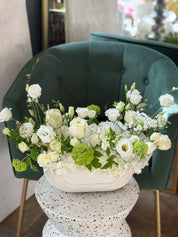 elegant white funeral flowers front facing arrangement GTA florist