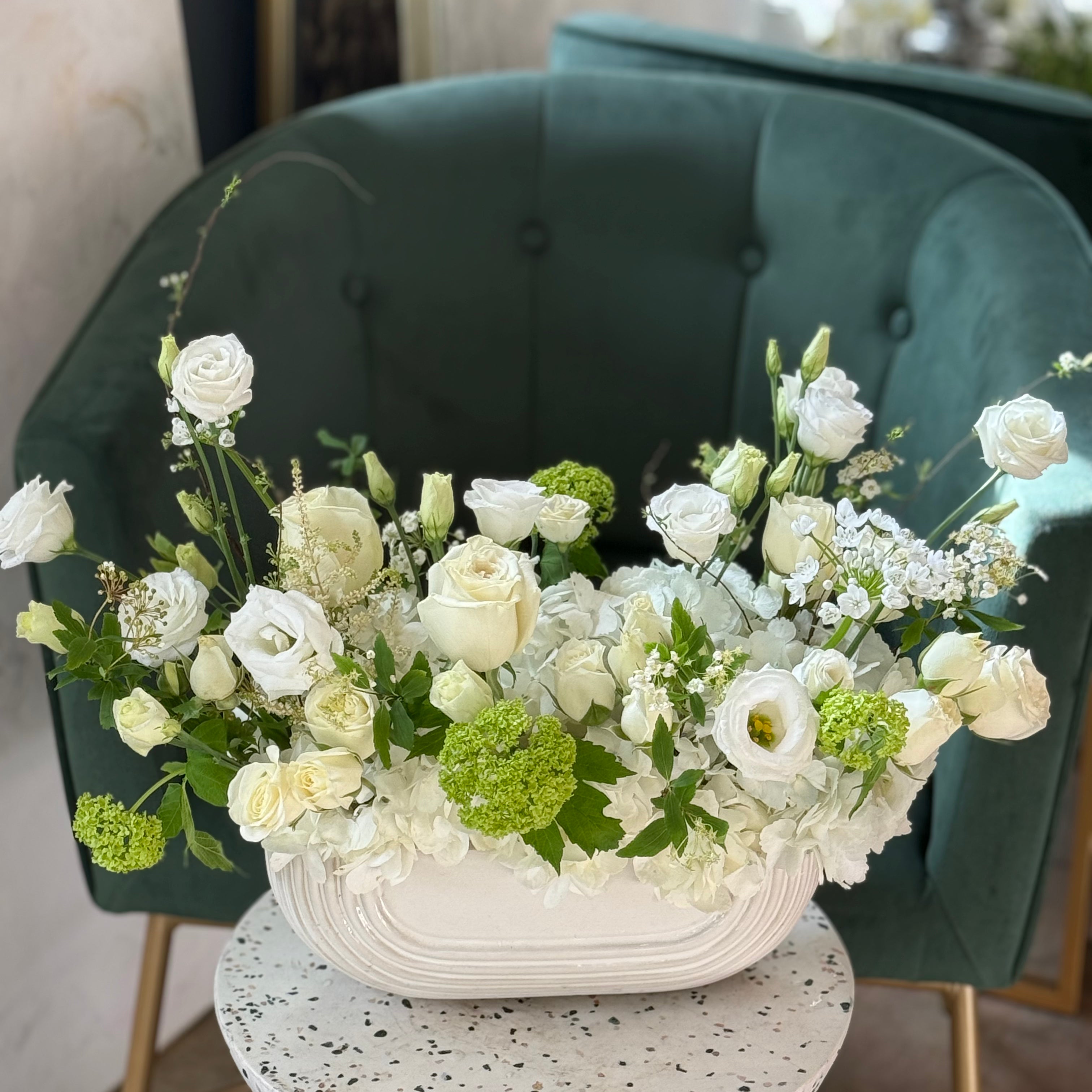 elegant white funeral flowers front facing arrangement GTA florist