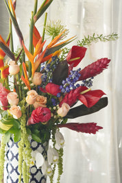 exotic flower arrangement modern tropical style with greenery