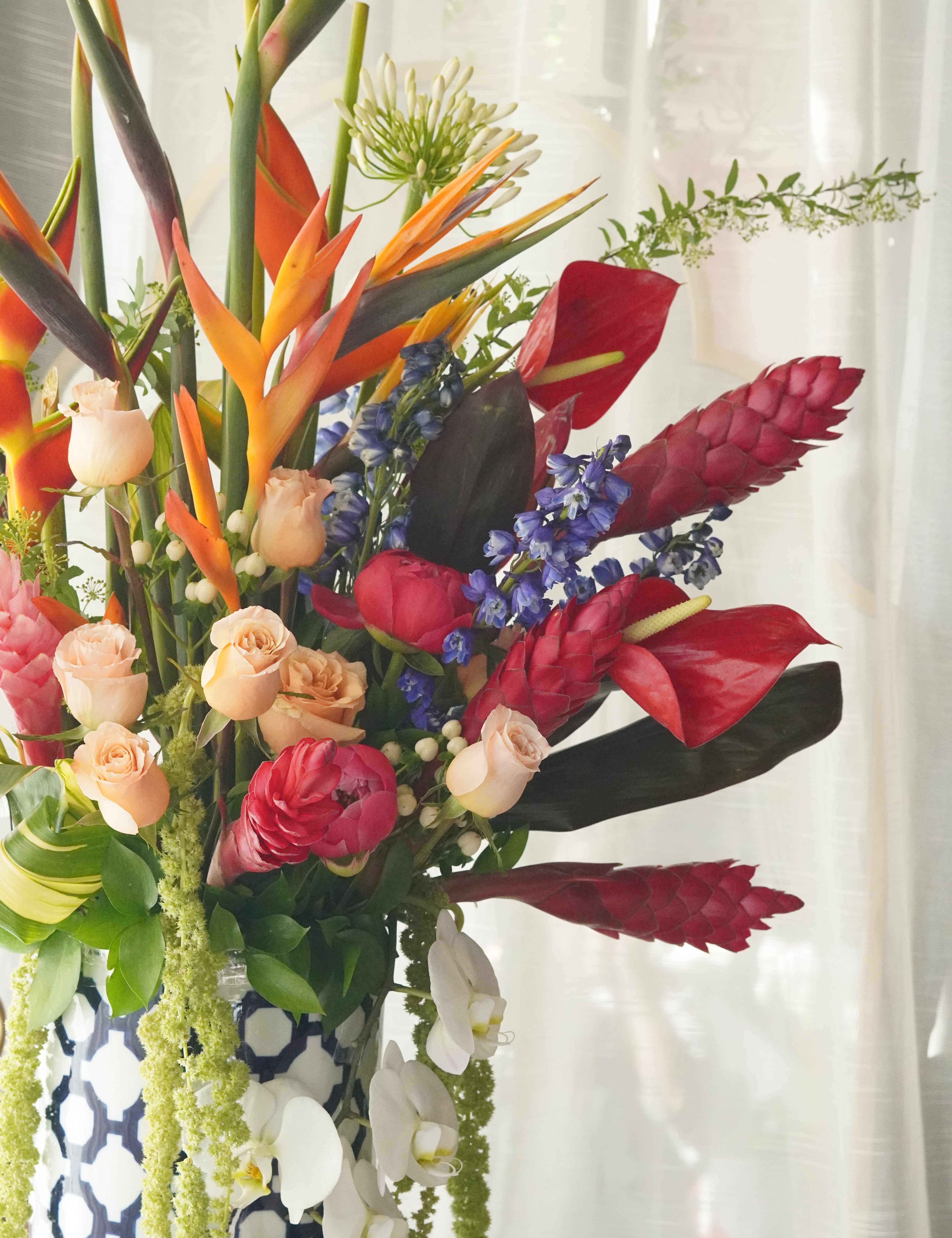 exotic flower arrangement modern tropical style with greenery