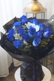 2 dozen blue roses with blue orchid