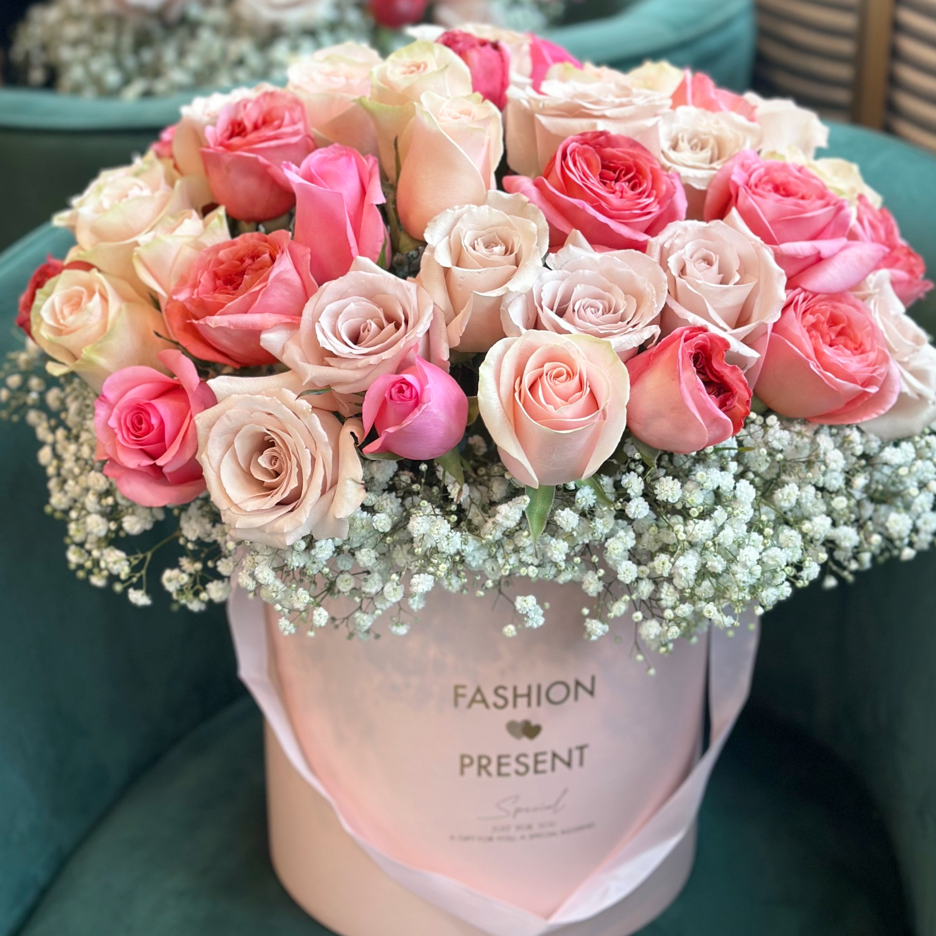 50 large white and pink roses arranged in a premium rose box with white baby's breath for classic touch by Moon's Flowers delivery in Oakville
