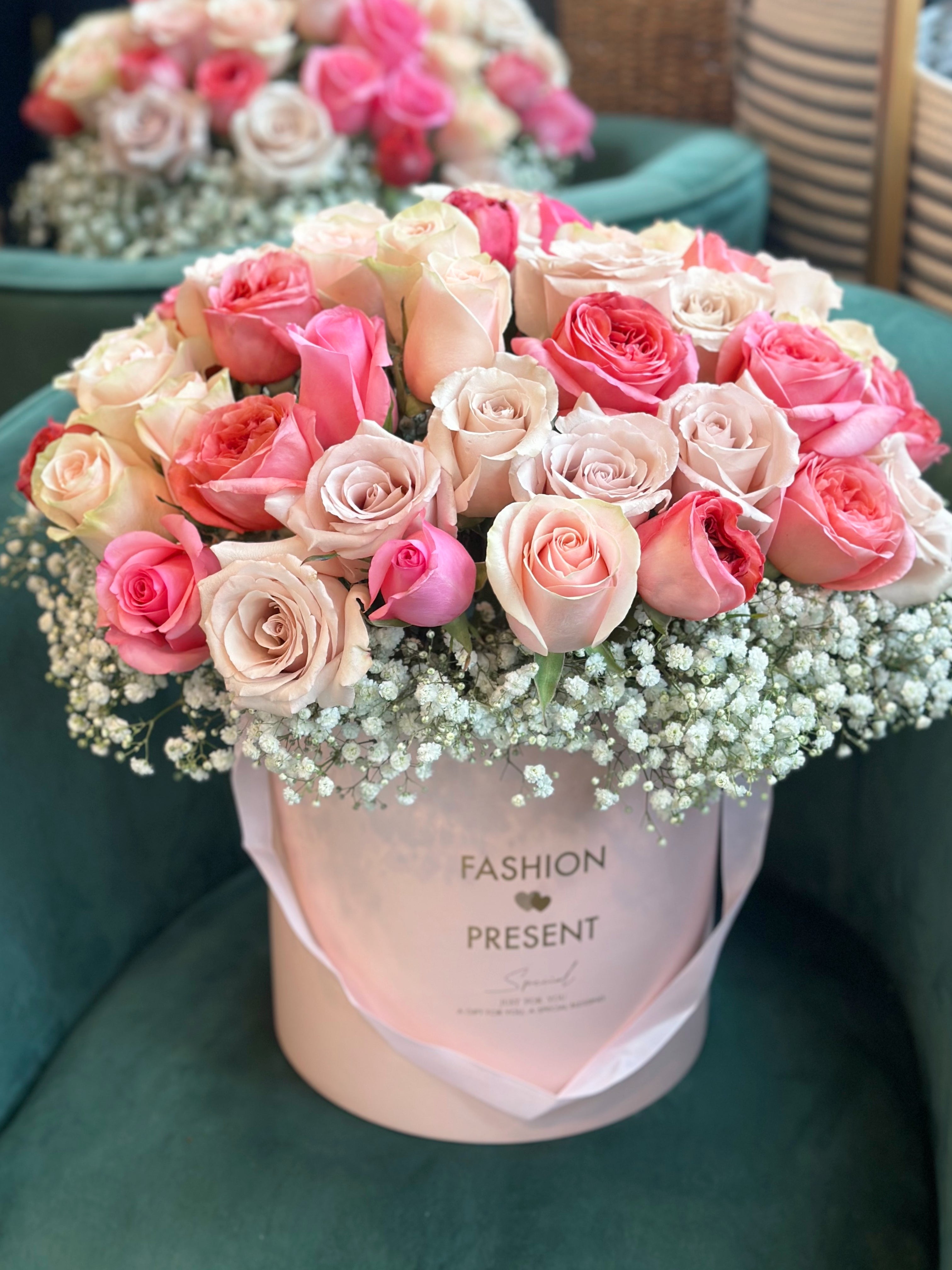 50 large white and pink roses arranged in a premium rose box with white baby's breath for classic touch by Moon's Flowers delivery in Oakville