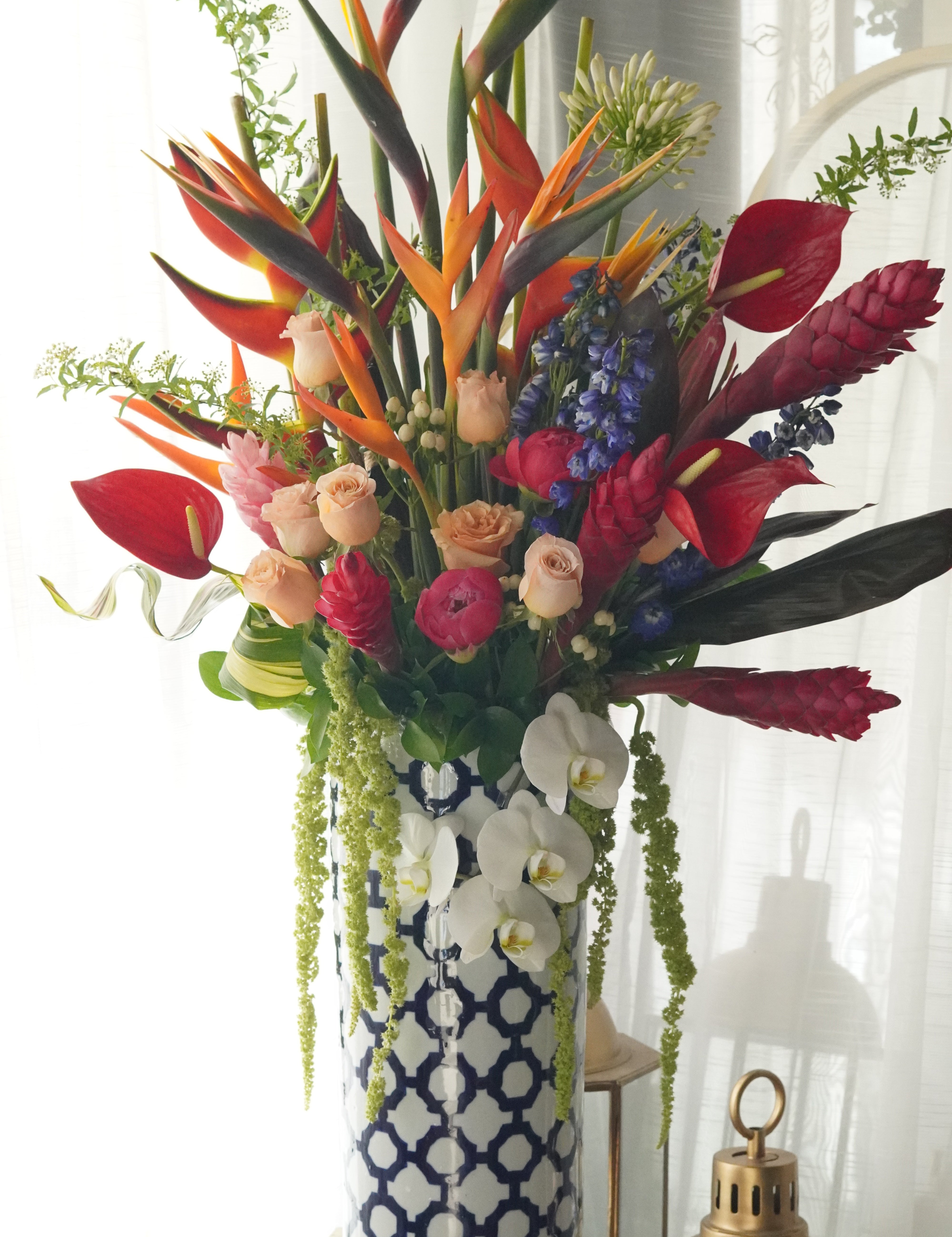 luxury tropical flower arrangement birds of paradise red ginger heliconia tall vase