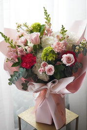 deluxe pastel pink floral bouquet with ribbon wrapping