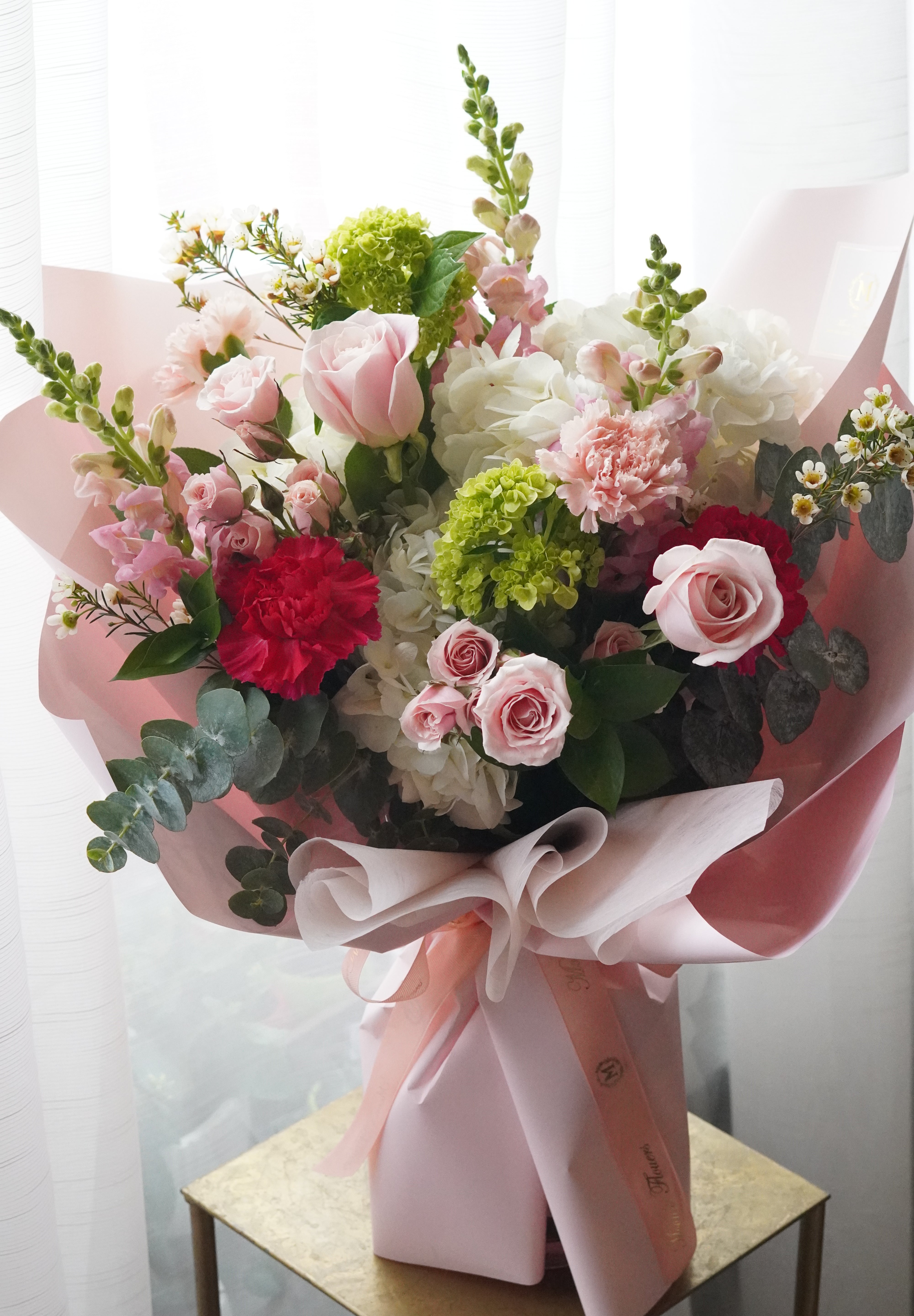 deluxe pastel pink floral bouquet with ribbon wrapping
