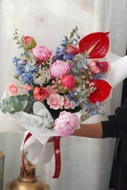 pink peonies and red anthurium luxury bouquet.A romantic symphony of blush pink and cream blooms with lush seasonal greenery. Hand-delivered floral gift in Mississauga, Toronto, and Oakville by Moon's Flowers.