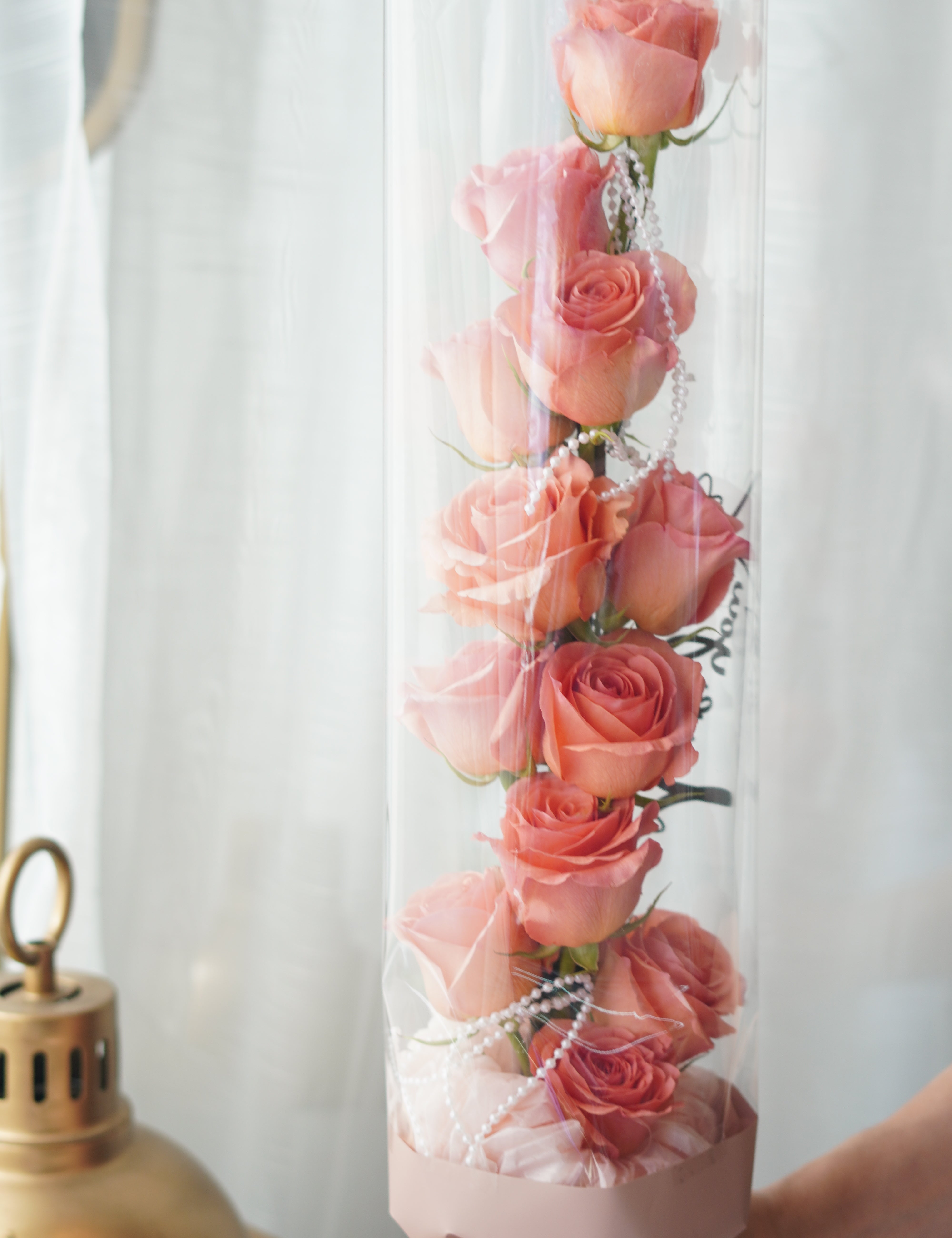 tanghulu rose bouquet full view, hand-held vertical rose bouquet with clear wrap and ribbon finish