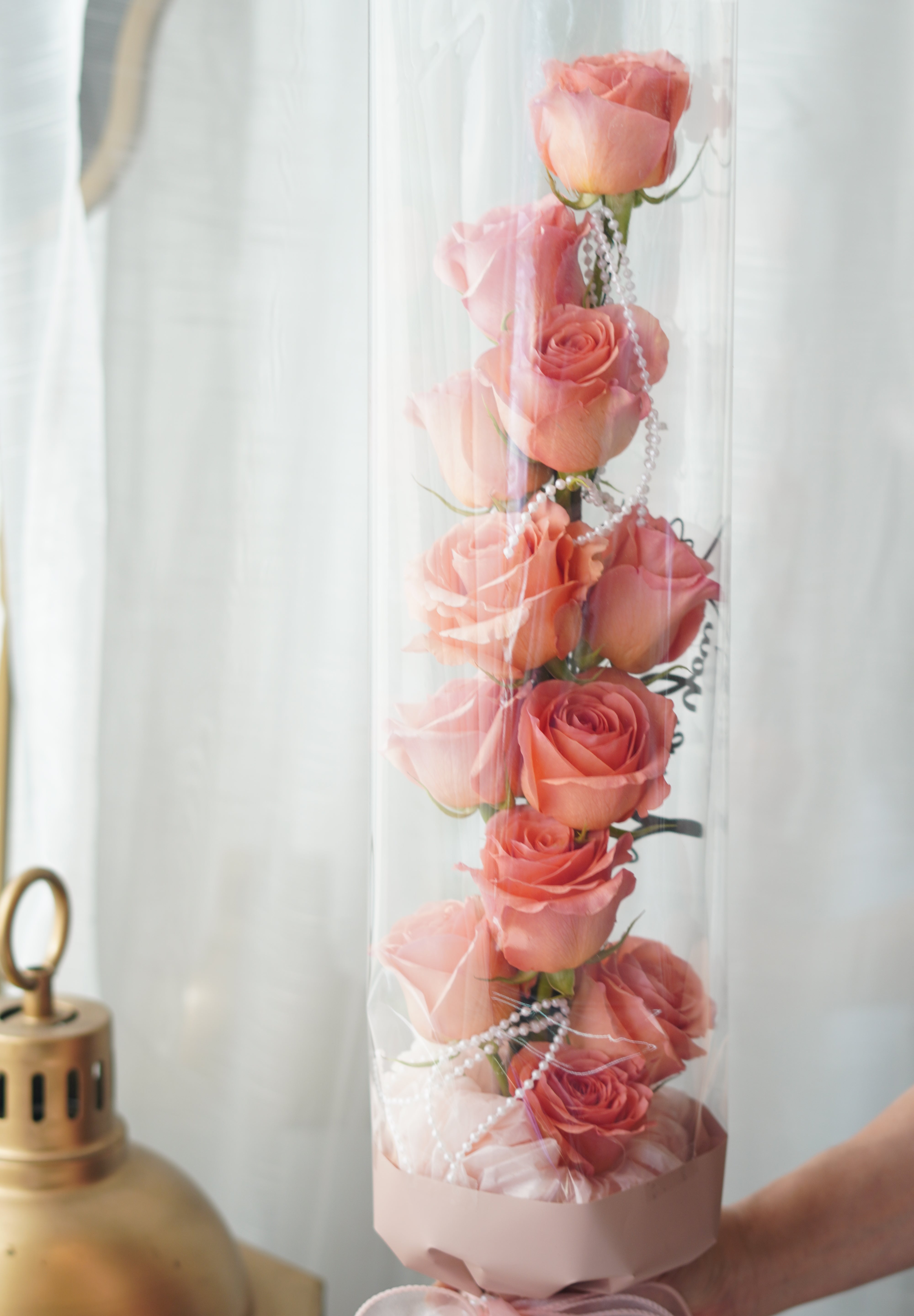 tanghulu rose bouquet full view, hand-held vertical rose bouquet with clear wrap and ribbon finish