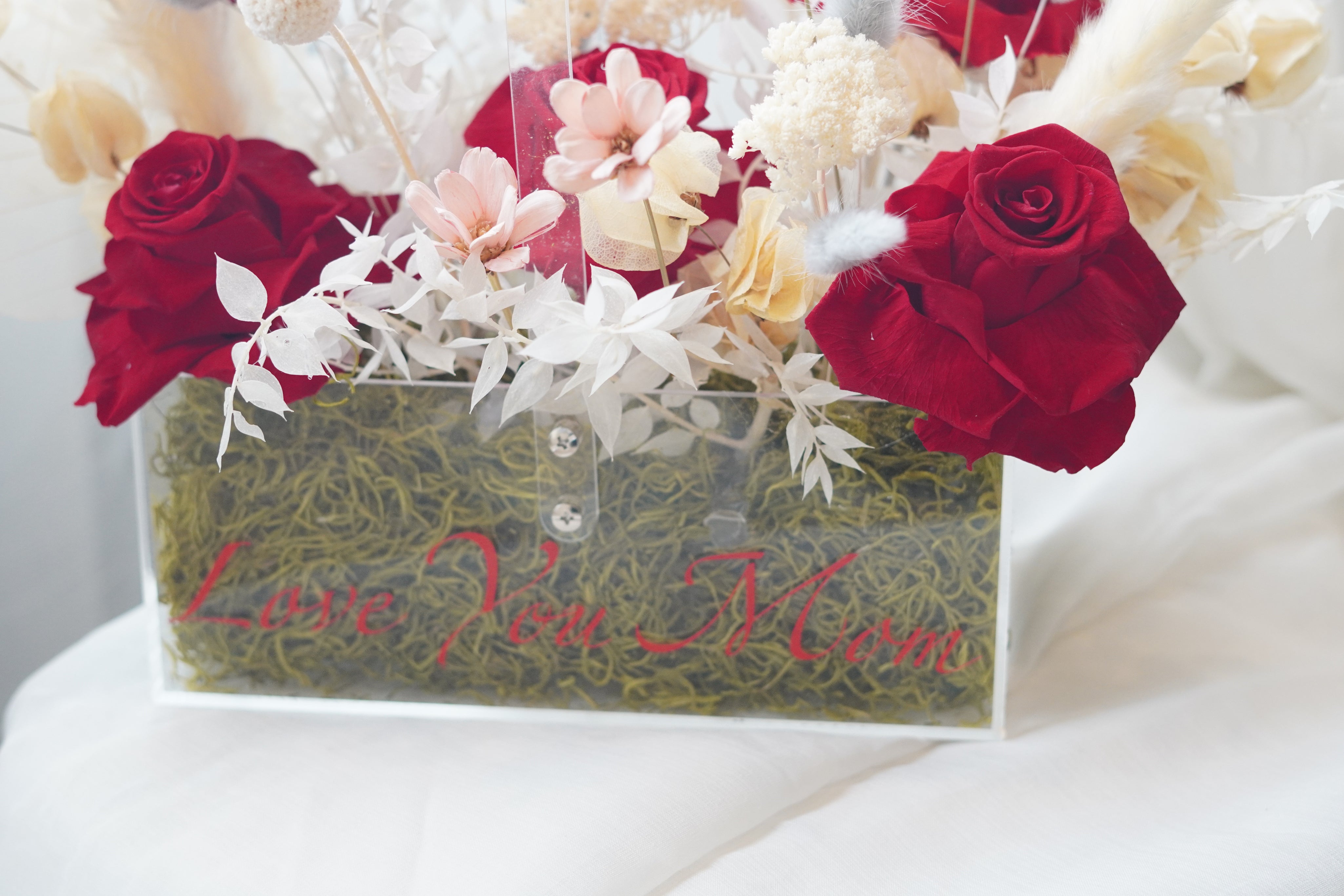 transparent flower box red roses dried florals