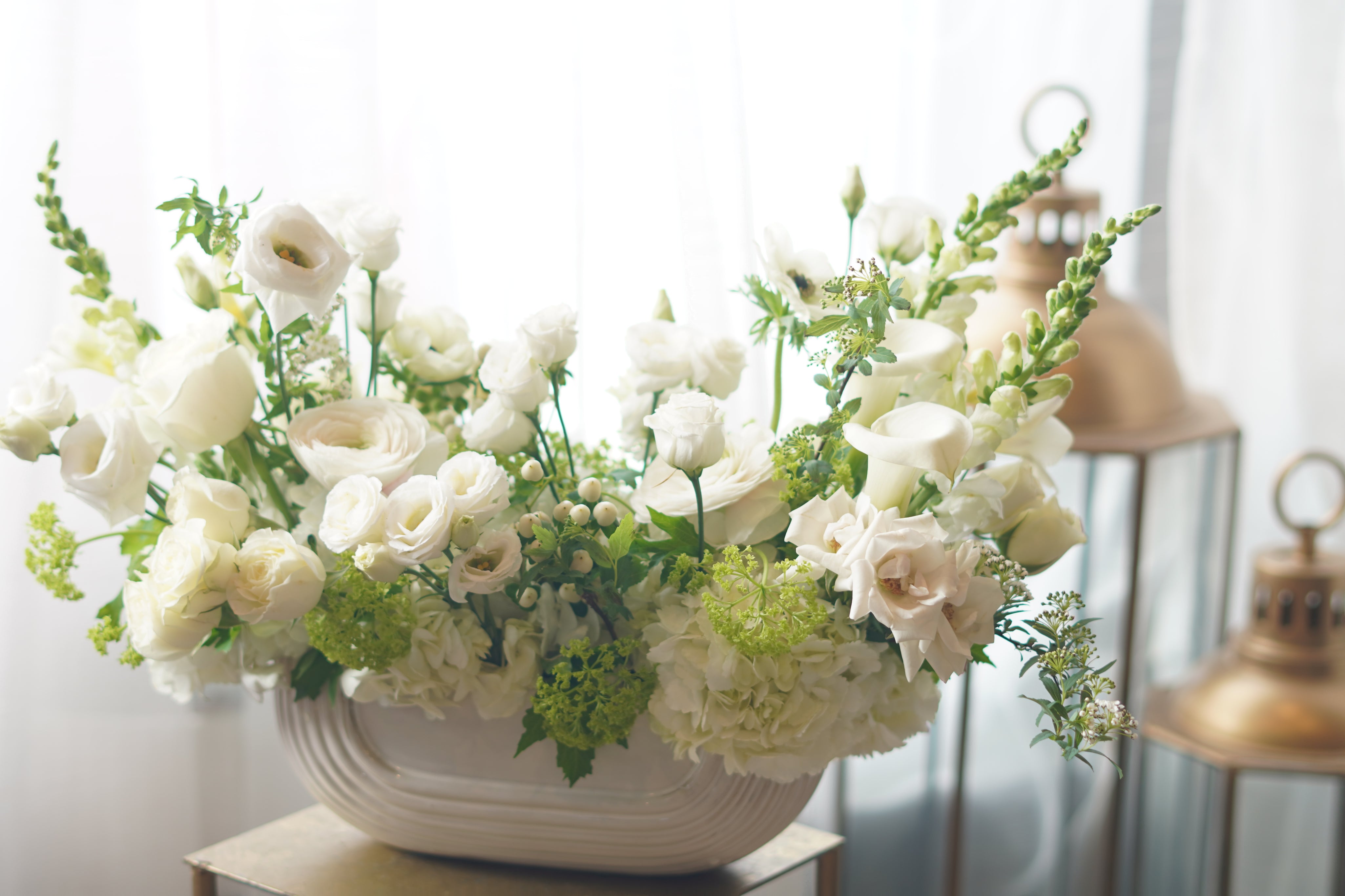 white sympathy flower arrangement in ceramic vase Toronto delivery