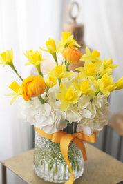 Yellow daffodil flowers symbolizing spring and renewal in vase arrangement
