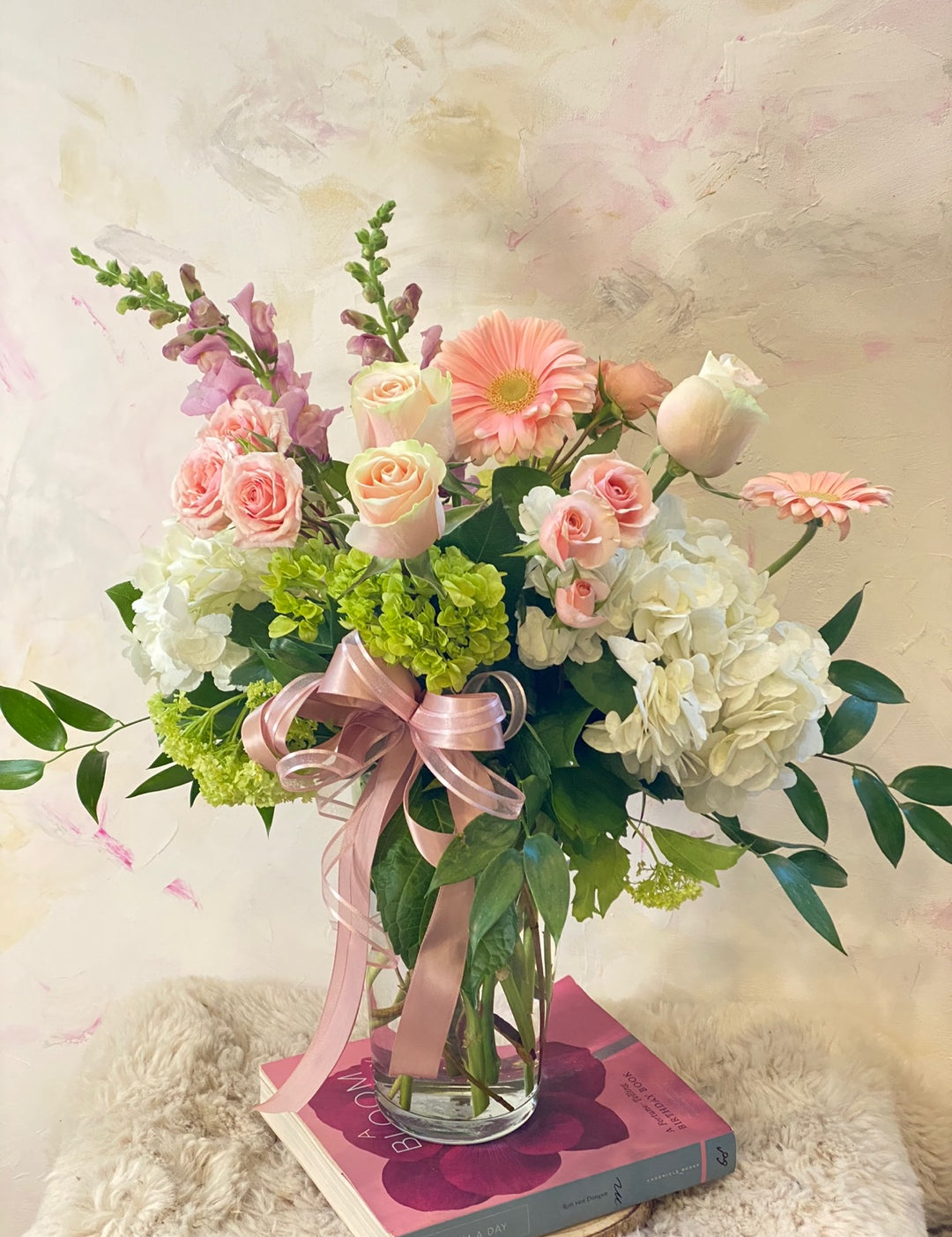 Up close image of the Mix Sympathy Flowers Vase. It uses a vase a variety of fresh seasonal flowers, like hydrangea, gerberas, roses and more.
