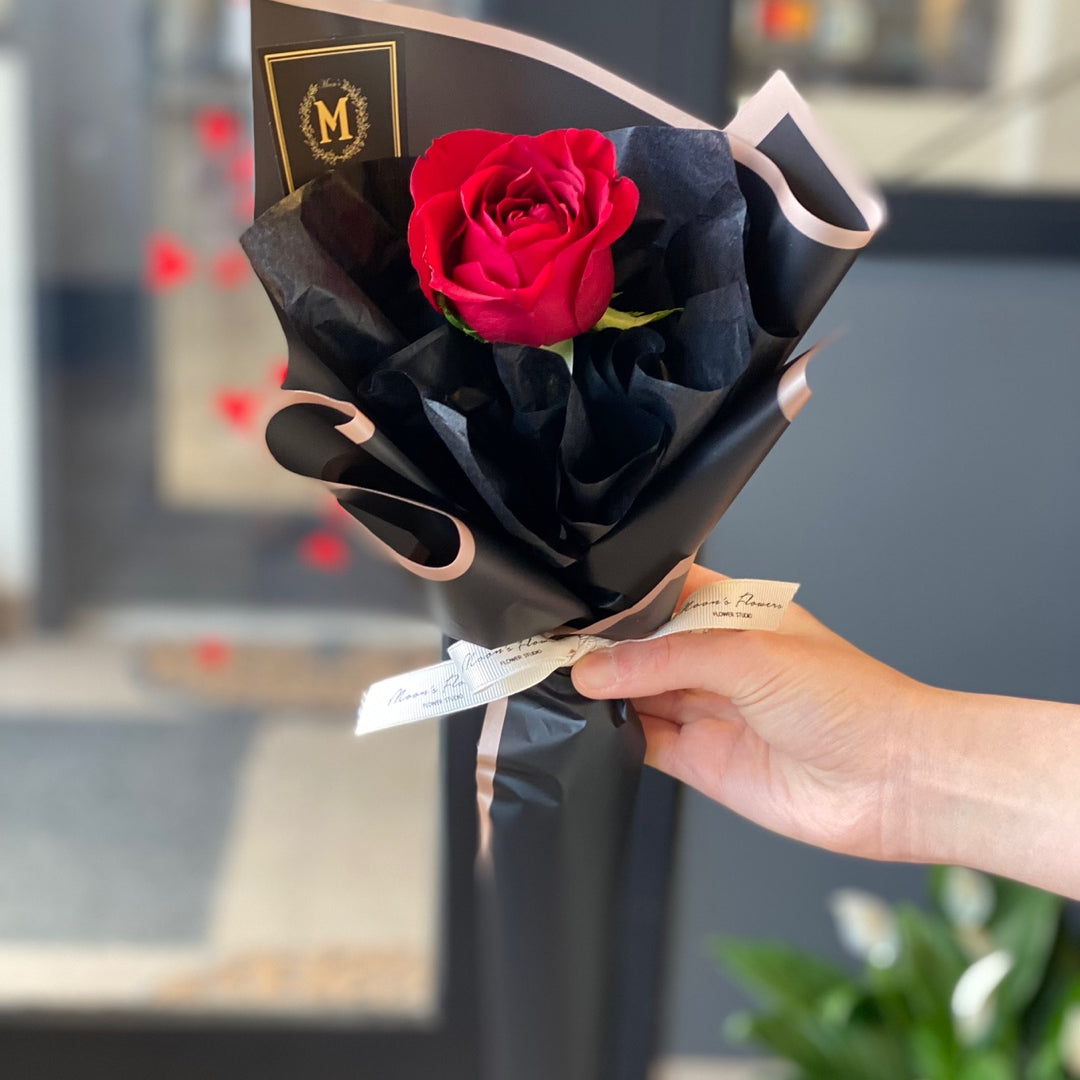 Classic long stem red rose wrapped in Moon’s Flowers’ signature style