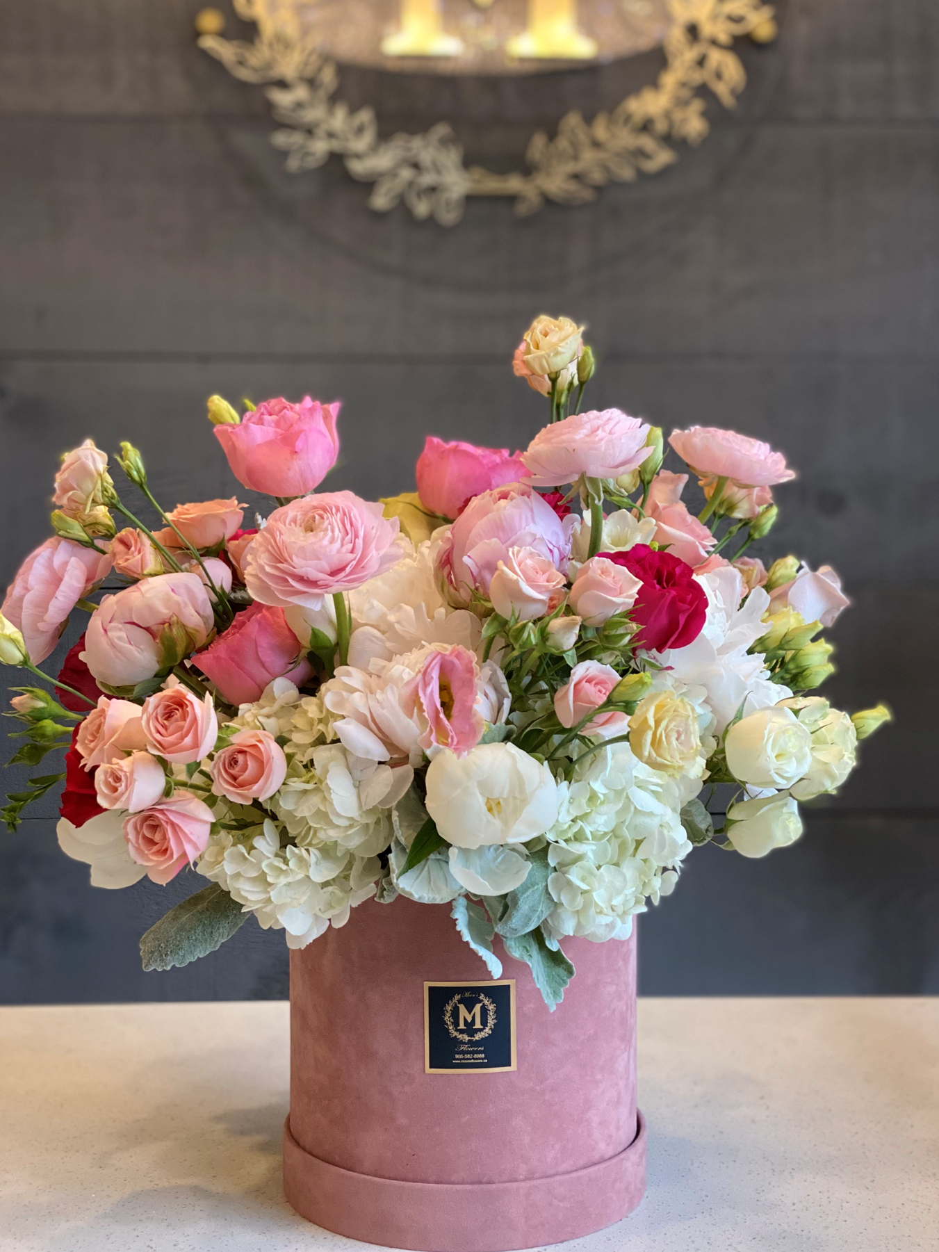 Grand luxury Mother's Day flower arrangement in a pink hat box featuring premium roses and hydrangea by Moon's Flowers Toronto
