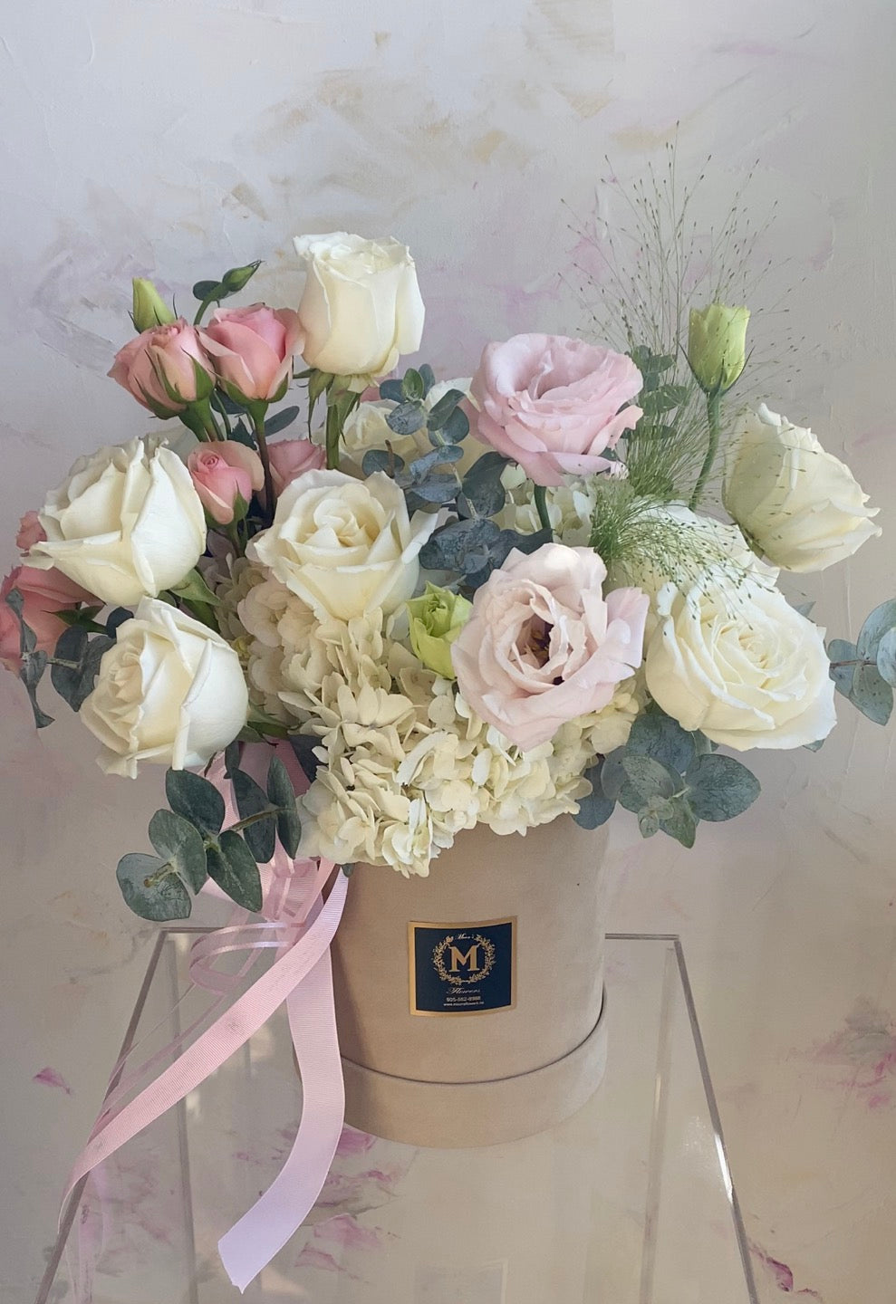 Blush flower box placed indoors with soft natural light – romantic gift idea Toronto