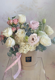 Blush flower box placed indoors with soft natural light – romantic gift idea Toronto